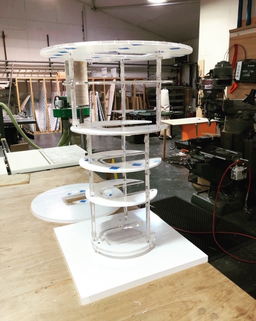 looks like a spaceship meets cake stand, but this well engineered acrylic fabrication represents parts of a scientific instrument used to rapidly cool items inside a laboratory. The centre of the Perspex discs have been machined out to take the original part